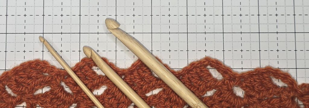 Beth is showing what bamboo crochet hooks look like