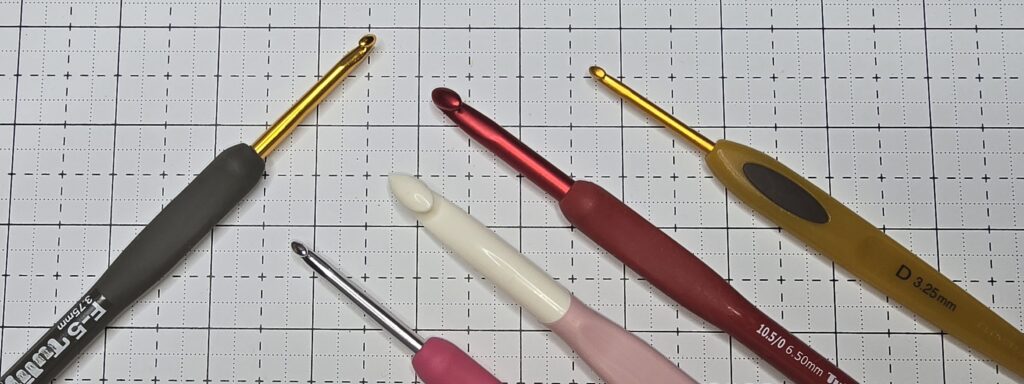 Elizabeth is showing you ergonomic crochet hooks with cushion handles