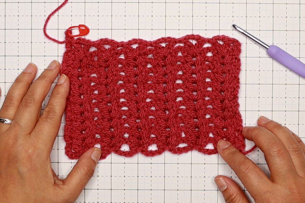 Beth is showing a sample tension pattern of the ribbed v-stitch